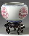 A pair of Chinese famille rose 'dragon' jardinieres