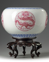 A pair of Chinese famille rose 'dragon' jardinieres