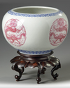A pair of Chinese famille rose 'dragon' jardinieres