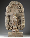 A large Chinese stone stele Buddhist triad