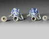 A PAIR OF CHINESE BLUE AND WHITE MOULDED EWERS AND TWO COVERS