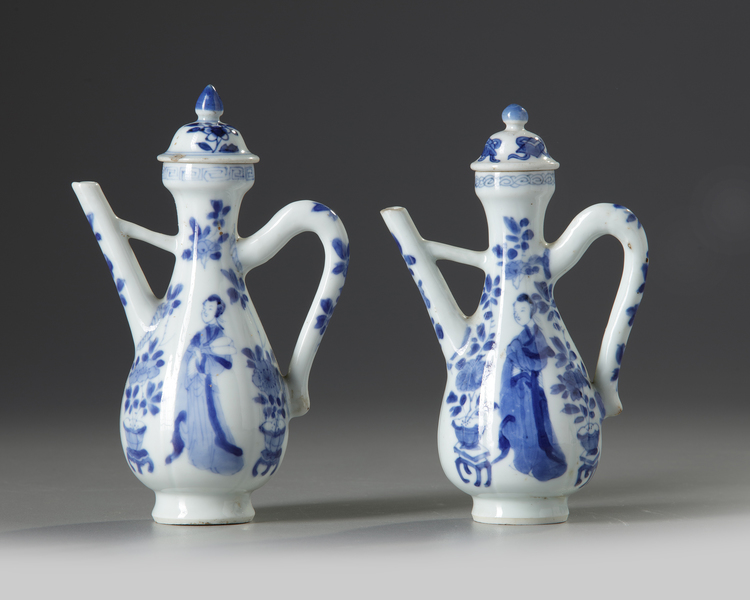 A PAIR OF CHINESE BLUE AND WHITE MOULDED EWERS AND TWO COVERS