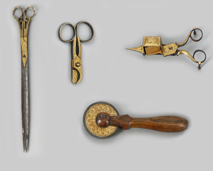 A group of four Ottoman gold-damascened calligrapher’s tools