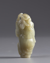 A Chinese pale celadon jade 'boy and lingzhi' carving