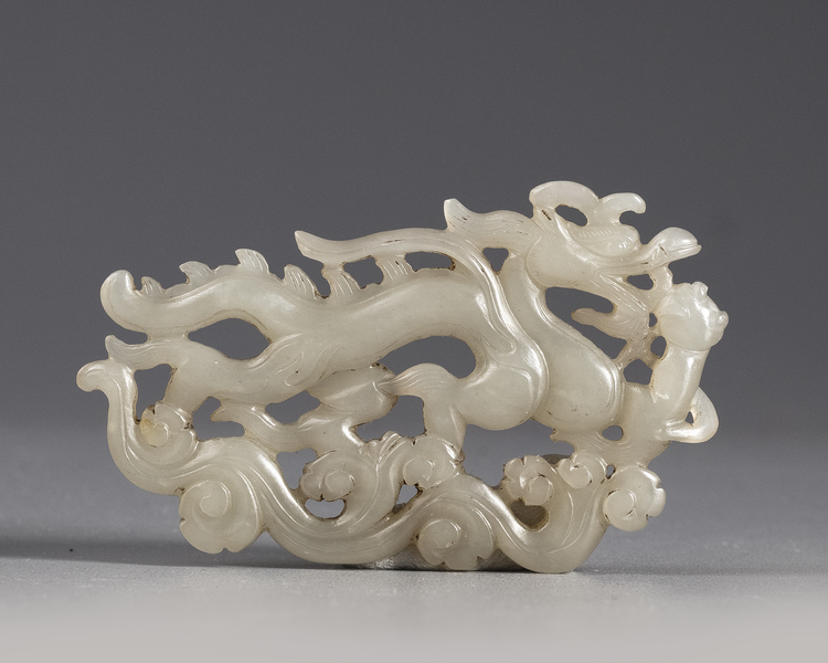 A Chinese white jade 'dragon' plaque