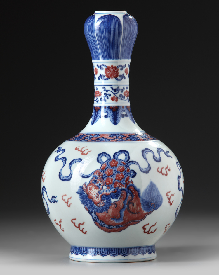 A Chinese copper-red-decorated blue and white garlic-head vase