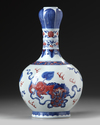 A Chinese copper-red-decorated blue and white garlic-head vase