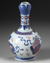A Chinese copper-red-decorated blue and white garlic-head vase