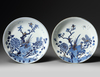 A PAIR OF CHINESE GILT-DECORATED BLUE AND WHITE 'PHEASANT AND PEONY' DISHES, KANGXI PERIOD (1662-1722)
