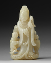 A CHINESE PALE JADE CARVING OG GUANYIN AND A BOY