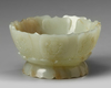 A CHINESE PALE AND RUSSET CARVED JADE 'LOTUS' CENSER