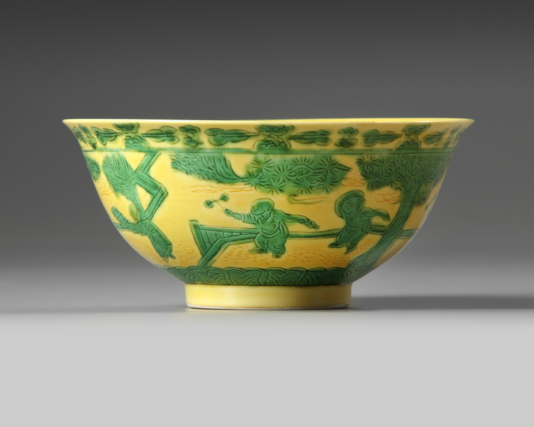 A CHINESE YELLOW-GROUND GREEN GLAZED 'BOYS' BOWL