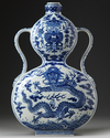 A Chinese blue and white double gourd moon flask