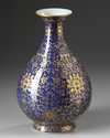 A gilt Chinese  pear shaped blue vase