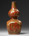 A Chinese coral red ground double gourd vase