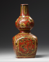 A Chinese coral red ground double gourd vase