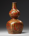 A Chinese coral red ground double gourd vase