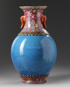 A CHINESE ROBINS-EGG AND FAMILLE-ROSE REVOLVING VASE, QING DYNASTY (1644-1911)