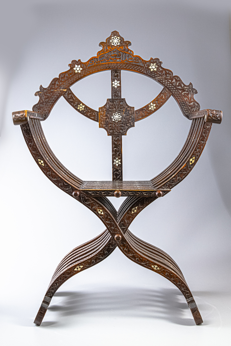 An Islamic mother-of-pearl inlaid wood chair
