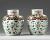 A PAIR OF FAMILLE ROSE GINGER JARS AND COVERS