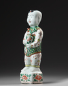 A CHINESE FAMILLE VERTE FIGURE OF A BOY