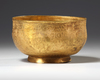 A PERSIAN GILT COPPER BOWL