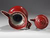 A CHINESE RUBY-RED GLAZED MONK'S CAP EWER