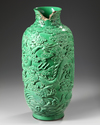 A CHINESE MOLDED GREEN GLAZED 'DRAGON' VASE