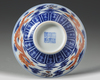 A CHINESE BLUE AND WHITE IRON-RED DECORATED 'DRAGON' BOWL, SIX-CHARACTER JIAQING MARK AND OF THE PERIOD (1796-1820)