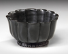 A MUGHAL BLACK GLAZED LOTUS SHAPED CERAMIC BOWL