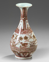 A CHINESE UNDERGLAZE COPPER-RED 'MANDARIN DUCKS' PEAR SHAPED VASE