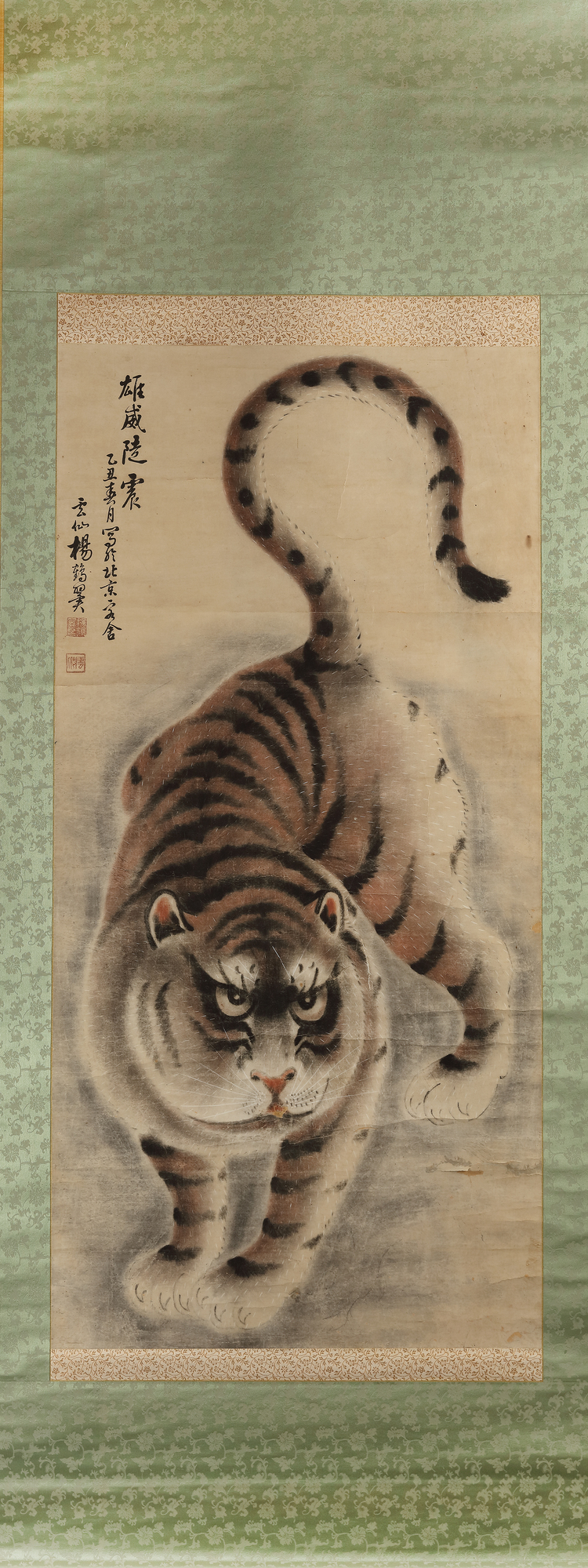 A CHINESE HANGING SCROLL WITH A POLYCHROME PAINTING OF A TIGER