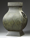 A LARGE JAPANESE FOUR SIDED GREEN BRONZE VASE