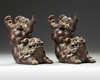 A PAIR OF CHINESE YIXING STONEWARE JUMPING BUDDHIST LIONS