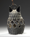 A JAPANESE CAST IRON HANGING LAMP IN THE SHAPE OF A HOMED OWL (MIMIZUKU)