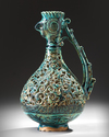 A RARE FRITWARE OPENWORK DECORATED RETICULATED EWER WITH ROOSTER HEAD, PERSIA, 13TH CENTURY