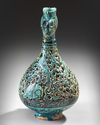 A RARE FRITWARE OPENWORK DECORATED RETICULATED EWER WITH ROOSTER HEAD, PERSIA, 13TH CENTURY