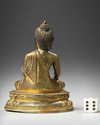 A SINO-TIBETAN GILT BRONZE FIGURE OF SHAKYAMUNI