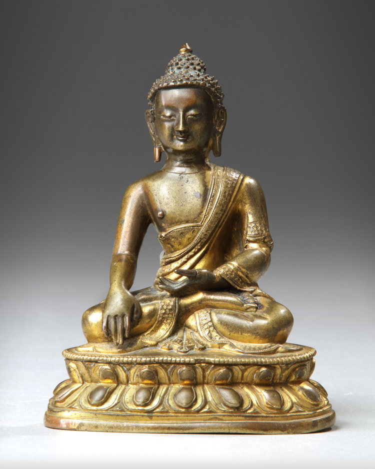 A SINO-TIBETAN GILT BRONZE FIGURE OF SHAKYAMUNI