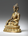 A SINO-TIBETAN GILT BRONZE FIGURE OF SHAKYAMUNI