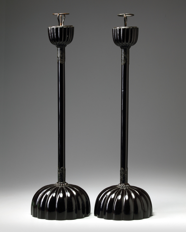 A PAIR OF LACQURED BUDDHIST TEMPLE CANDLE HOLDERS