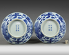 A PAIR OF CHINESE BLUE AND WHITE 'PHOENIX' DISHES