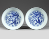 A MATCHED PAIR OF CHINESE BLUE AND WHITE 'DRAGON' DISHES
