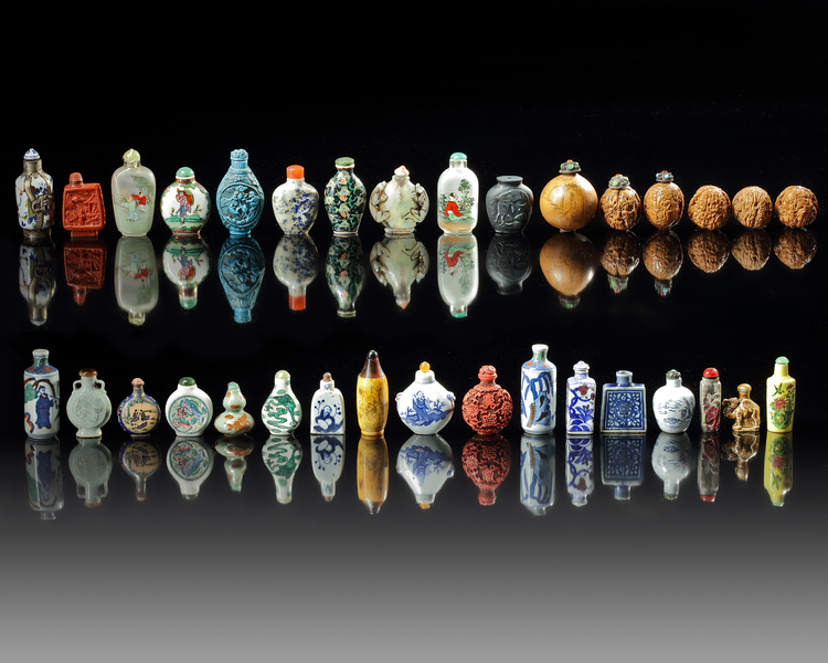 A GROUP OF THIRTY CHINESE SNUFF BOTTLES AND THREE CARVED WALNUTS