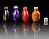 A GROUP OF FOUR CHINESE PEKING GLASS SNUFF BOTTLES