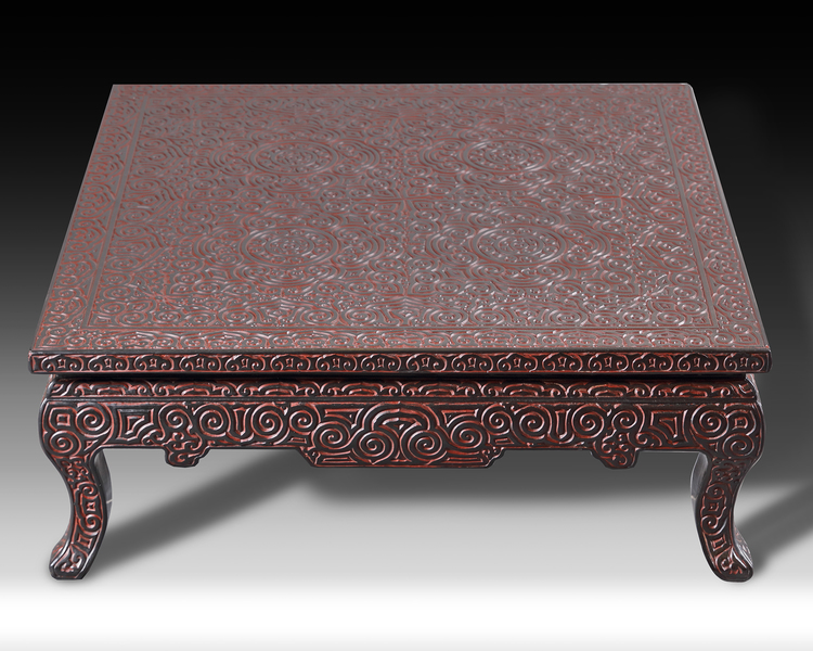 A LOW SQUARE CHINESE TSUISHITSU (CARVED LACQUER LACQUERWARE TABLE