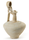 A SELJUK UNGLAZED POTTERY EWER, PERSIA,12TH-13TH CENTURY