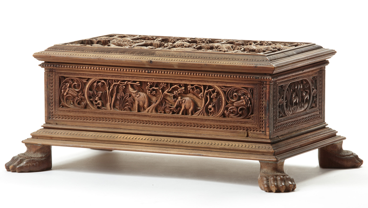 A DEEPLY CARVED SANDALWOOD CHEST WITH HUNTING SCENES