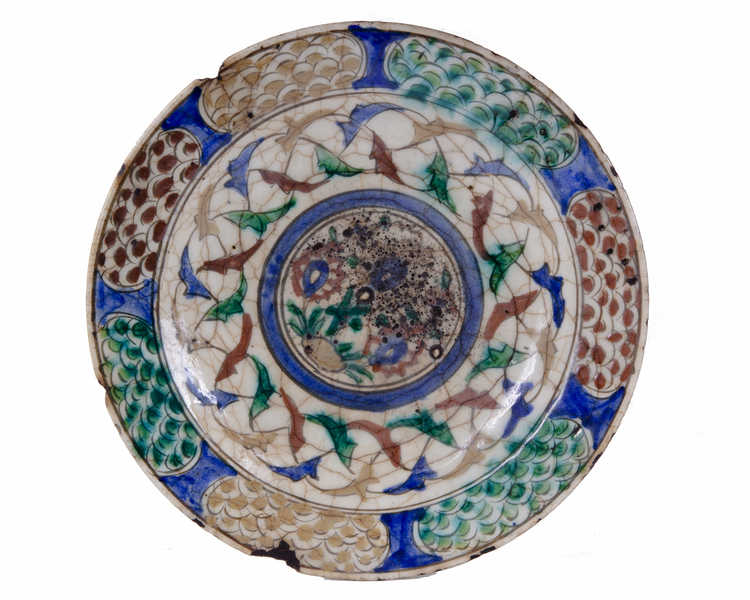 A PERSIAN KUBACHI POLYCHROME POTTERY DISH, NORTH-IRAN, EARLY 17TH CENTURY