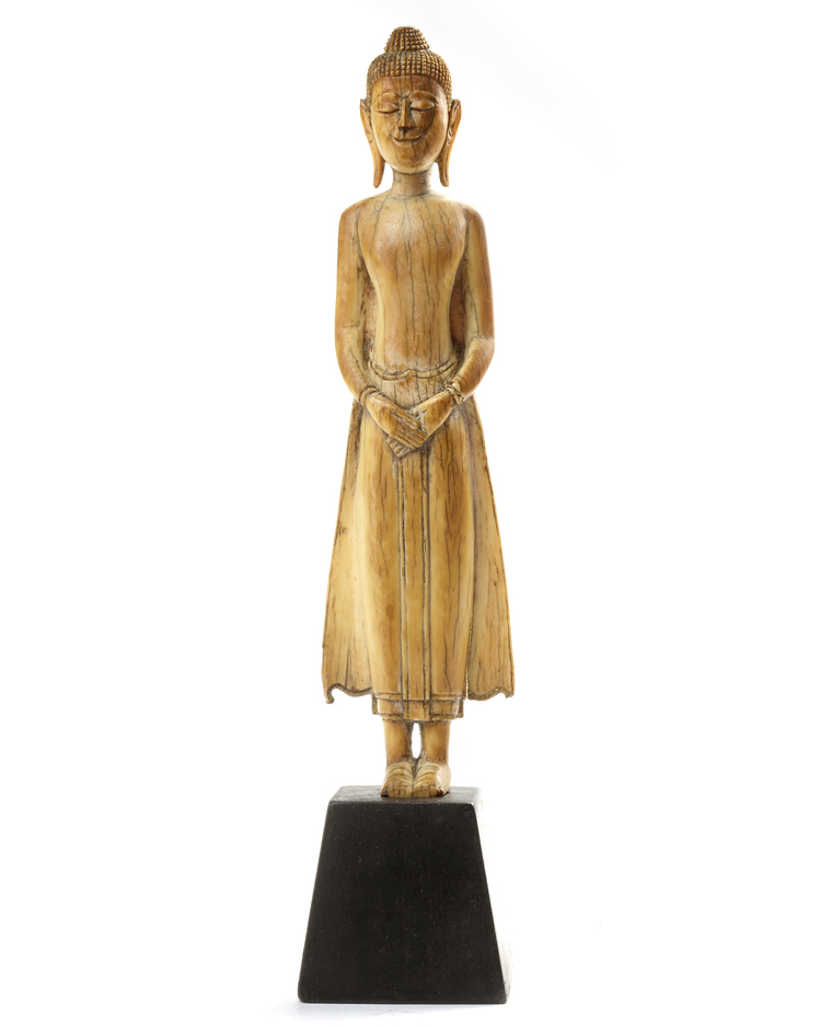 A THAI IVORY STANDING FIGURE